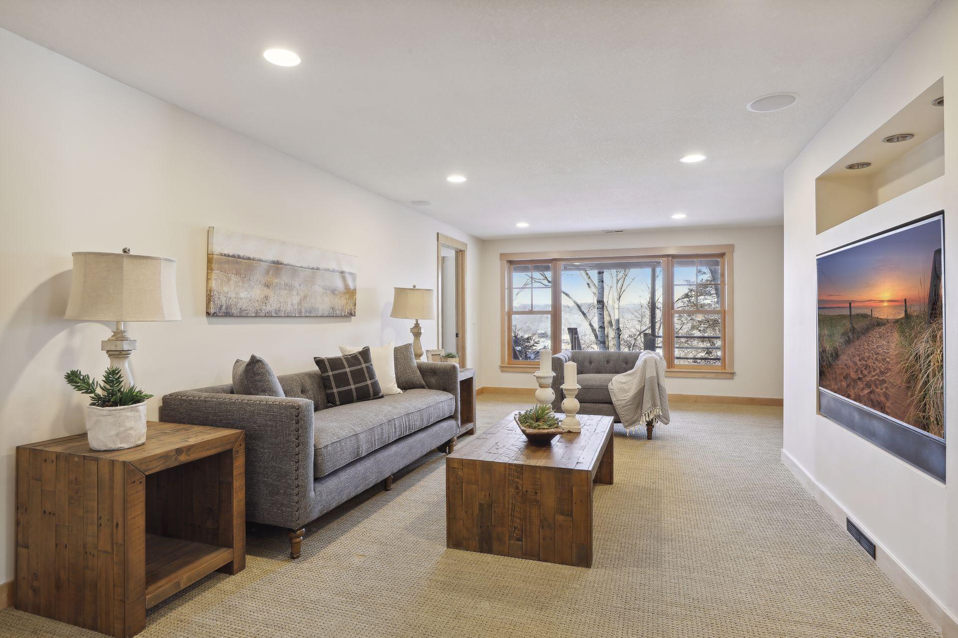 The walkout level features in floor heat throughout, and this family room is a comfortable space to hang out and watch some TV.