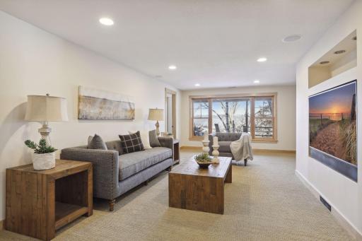 The walkout level features in floor heat throughout, and this family room is a comfortable space to hang out and watch some TV.