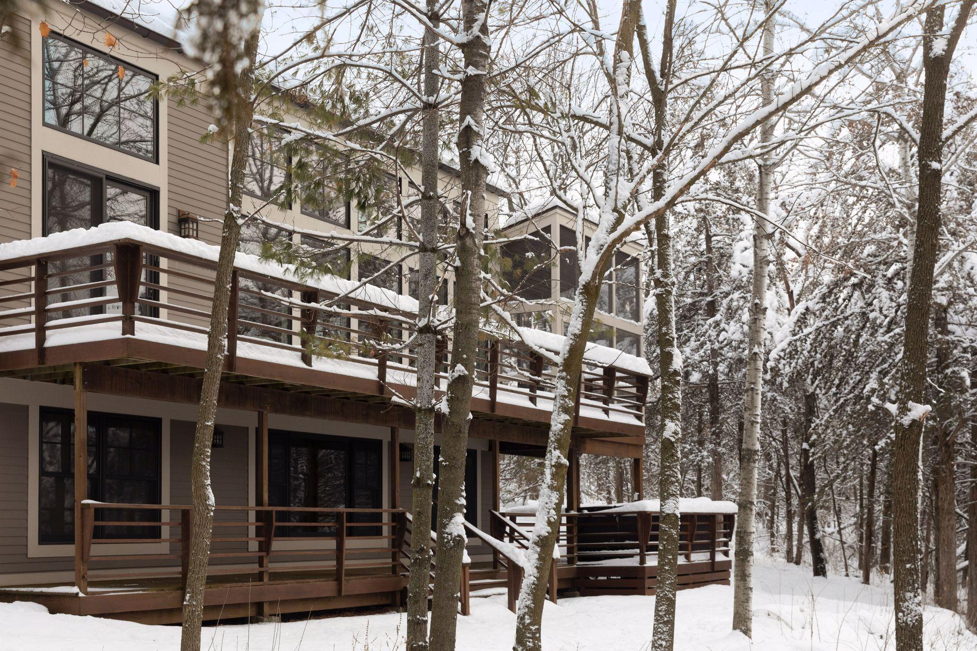 The view of the home that faces the river-enjoy all the windows to take in the stunning scenery year round!