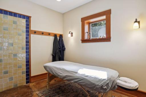 Massge room with open shower and adjoining sauna