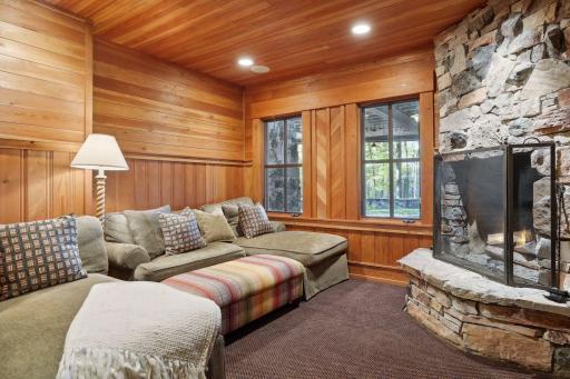 Cozy media room with woodburning fireplace