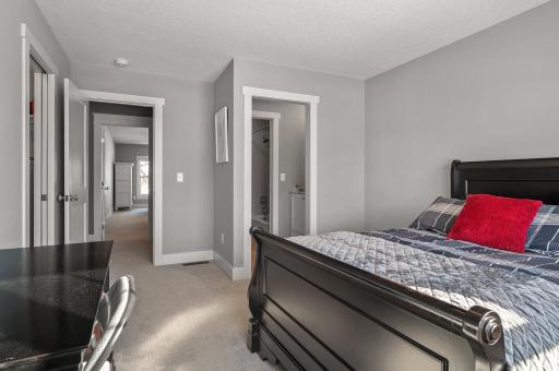 Bedroom with connecting Jack & Jill bathroom overlooks the front of the home