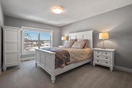 Bedroom #2 connecting to Jack & Jill bathroom overlooks wetlands behind the home