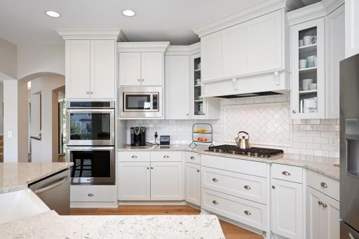 European Oak floors through foyer, kitchen, dining room, breakfast area, and powder room