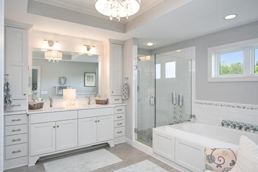 Spacious owner's bathroom with separate tub and shower