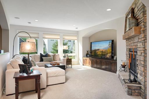 Classy and charming lower level family room with large windows and high ceilings
