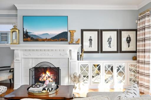 Built-in bookcases, decorative fireplace and TV mount