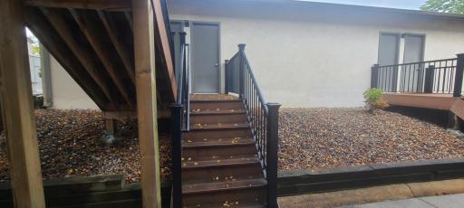 Stairs from front door up to garage service door.