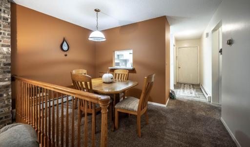 Back inside....the dining room is right next to the hallway access that leads to the bedrooms and full bathroom.