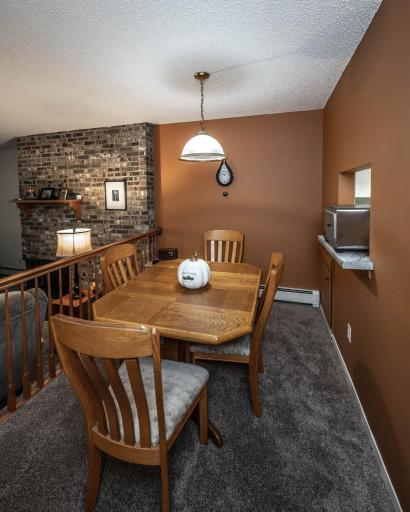 Large dining room open to the living room with pass through window/breakfast bar seating into the kitchen.