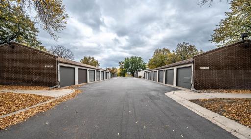 Detached 1 car garage with each unit. Has garage door opener and fully enclosed from others. Open rafters for some storage.