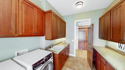 Cherry cabinetry with underneath lighting. Transom window. New Electrolux washer/dryer purchased in 2021