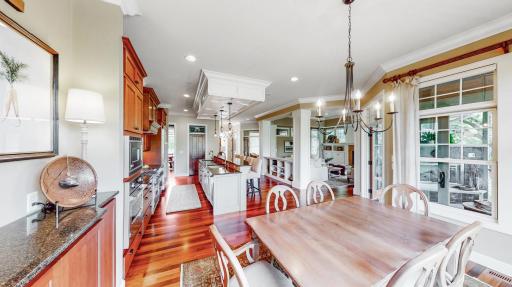 Informal dining room has cherry hardwood built-in cabinetry & Cambria counter top