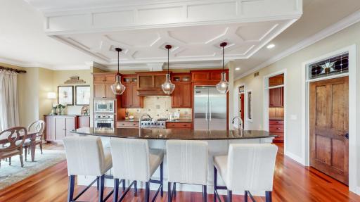 Cabinetry is cherry hardwood & millwork & center island paneling white enamel