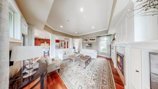 The living room crown molding & millwork is white enamel to contrast nicely with the floor.
