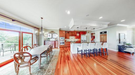 Informal dining room with sliding glass door to deck. Between the informal dining room & kitchen center island 10 people can dine.
