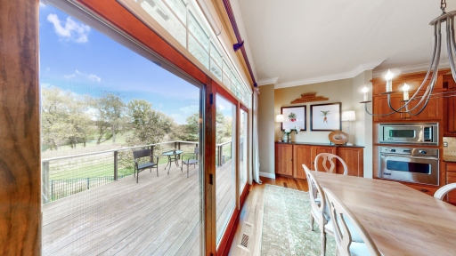 View of back deck & golf course from informal dining room
