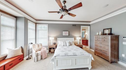 Over-sized master bedroom includes a nook with cherry cabinetry & bookcase.