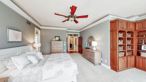 White enamel millwork & crown molding with lighting.