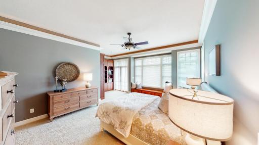 Large Marvin windows on two walls that feature Hunter Douglas window coverings