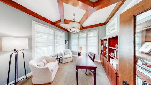 Large office with decorative birch architecture design. French doors & 3 transom windows. Built-in cabinets are cherry hardwood.