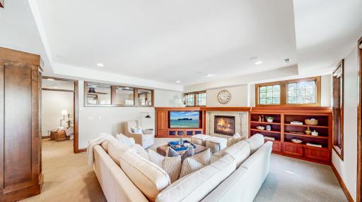 Family room with gas fireplace & travertine surround