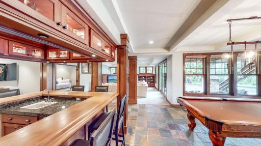 Lower level with 9' ceilings. Bar & billiards rooms with beautiful slate tile in-floor radiant heating.