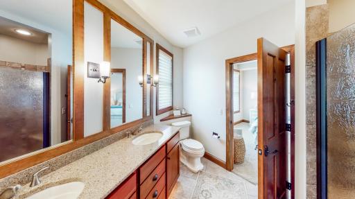 Jack and Jill Bathroom with Kohler plumbing & Cambria double sink counter top & backsplash