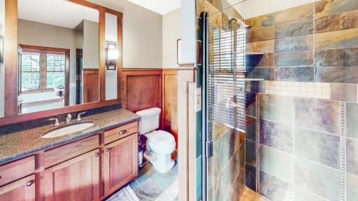 Bathroom has all Kohler sink/faucets & plumbing. Cambria counter top and back splash. Cherry cabinetry