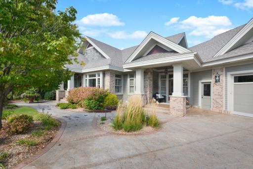 Stamped concrete sidewalk & front porch with Hardy board cement siding. Full gutters and down spouts on home.