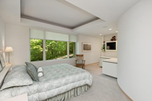 The third bedroom is lovely and showcases a curved wall, dual windows and walk-in closet.