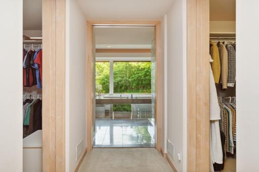 There are two walk-in closets to assist in daily organization with full built-in dressers and surrounding storage shelves.