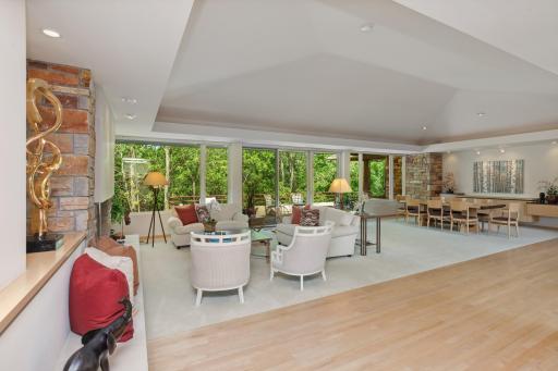 The architect delicately designed this floor plan to embrace the exterior surroundings with volume ceilings, intricate angles, warm soffits and an abundance of windows.