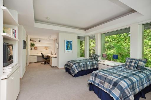 One of these suites includes a handicap-accessible bedroom with ample space for a wheelchair to roll into the ceramic-tile surround shower, around the spacious bedroom with space for two beds, a walk-in closet, or in the en-suite office area. with b