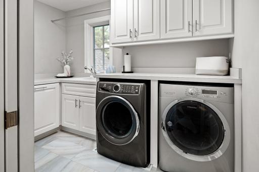 Second floor laundry with good storage and folding counter