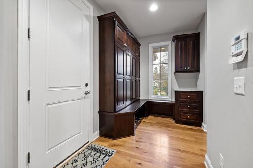 Mudroom with storage and walk-in closet to the right