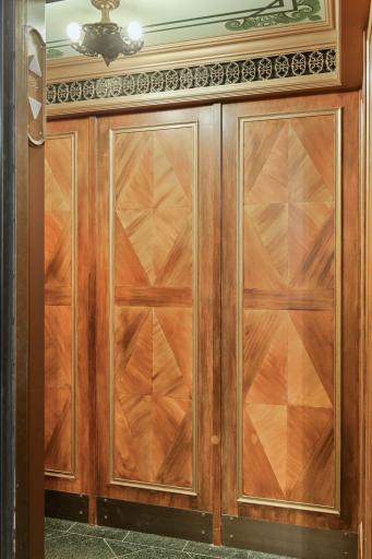 Beautiful walnut paneling in the elevators.
