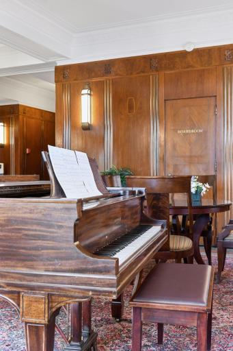 Baby grand piano greets you as you enter the front lobby.