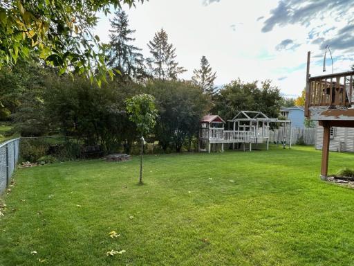 Photo for 4936 Campanaro Lane, White Bear Lake, MN 55110 - Listing #6267015 View from front yard into the back yard. The fire pit is in the left back corner. The trees offer some nice privacy on the back lot line.