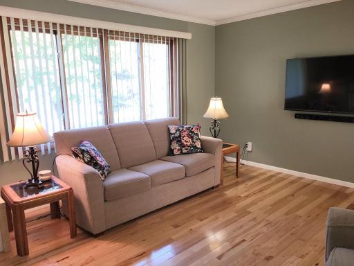 Photo for 4936 Campanaro Lane, White Bear Lake, MN 55110 - Listing #6267015 Large windows make this living room bright and cheerful! The cove molding off the ceilings surrounds the entire room!
