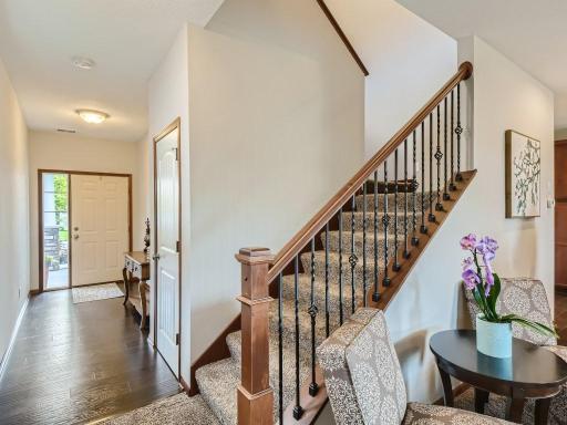 Photo for 12422 Alamo Street NE, Blaine, MN 55449 - Listing #6267681 Foyer and coat closet with storage space under the stairs.