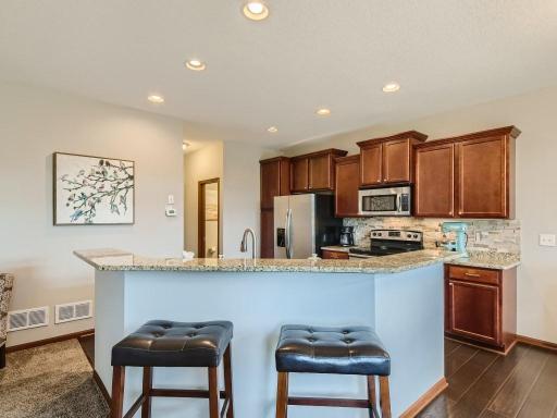 Photo for 12422 Alamo Street NE, Blaine, MN 55449 - Listing #6267681 Kitchen with center island and granite counter tops.