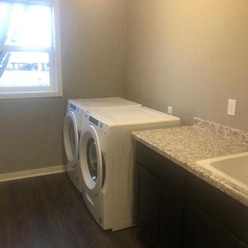 Main level laundry room off of the entry- similar model home