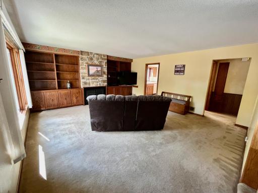 Living room with built ins & gas fireplace