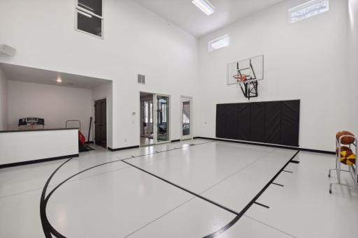 Indoor Sport court w/exercise area on walk out level. Ping pong table storage room too!