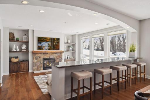 Overlook seating area and gas fireplace. Built-in cabinetry.