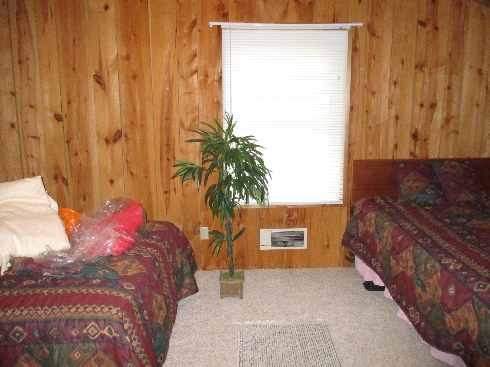 33. Bedroom in bonus room above garage.JPG