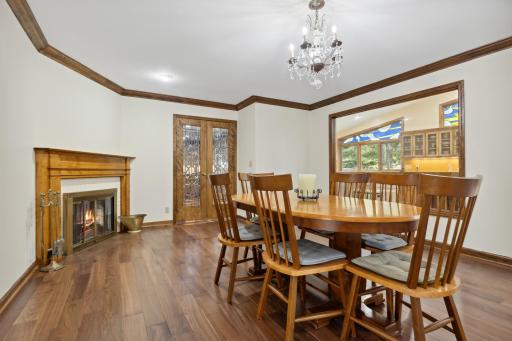 Large Formal Dining Room Features Rich New Hardwood Floors and Fireplace