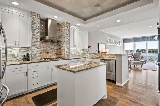 Kitchen features gas cook top, wall oven, and gorgeous granite and tile!