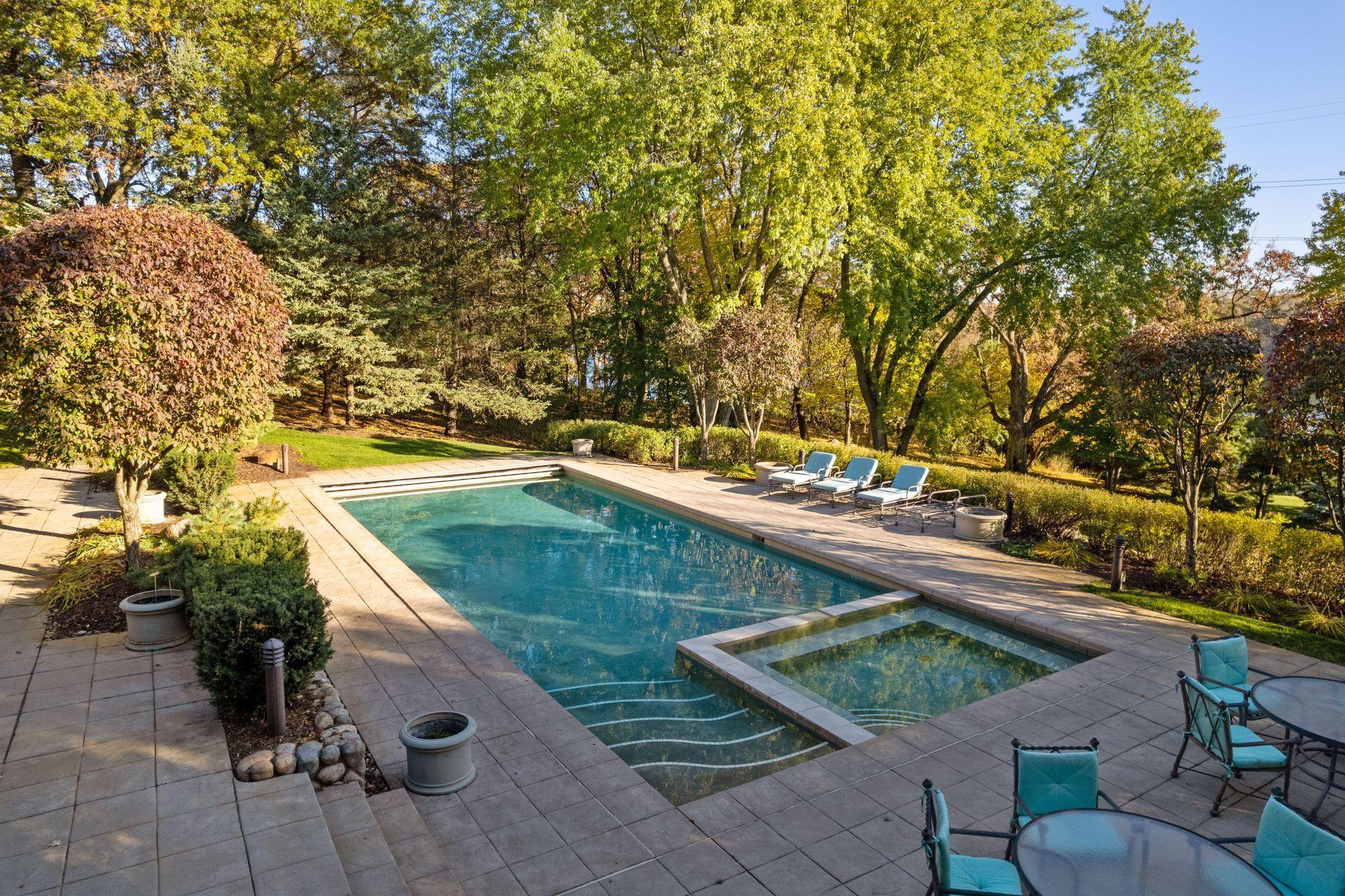 Walk Out Lower Level to Patio Area and Pool Deck